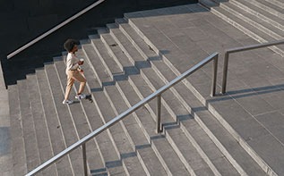 woman walking up stairs