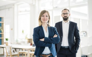 A man and woman in business clothes