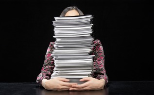 files in front of a woman 