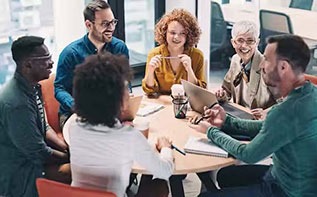 group of people talking at a table